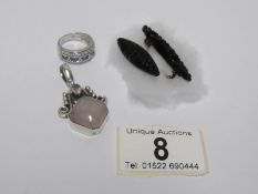 A silver and rose quartz pendant, a silver ring,