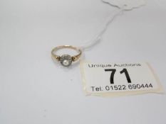 A 1930's diamond cluster ring set with old cut diamonds and centre pearl,