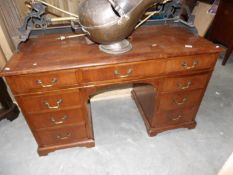A walnut 9 drawer writing desk