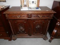 A heavy 19th century carved oak cabinet