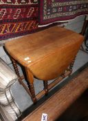 An oak barley twist gate leg table