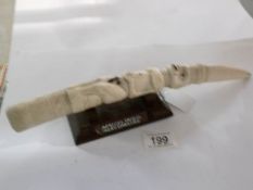 A 19th century carved ivory African fertility carving (some cracks)