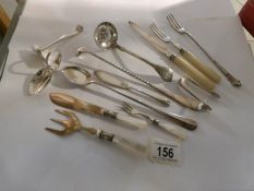 A mixed lot of silver plate and EPNS cutlery including sifter spoons, pickle forks,