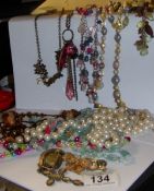 A mixed lot of costume jewellery including necklaces and brooches