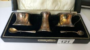 A cased silver condiment set