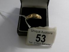 A heavy yellow gold diamond solitaire ring,