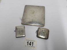 A silver card case and 2 silver vesta cases