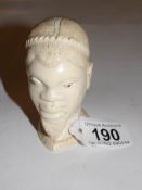 A 19th century carved ivory African male head