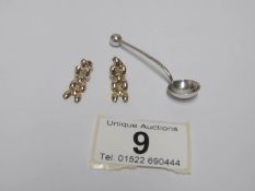 A pair of gold earrings and a H M silver salt spoon