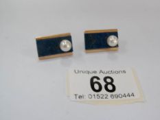 A pair of art deco earrings set with lapiz lazuli and pearls in unmarked gold setting (approximate