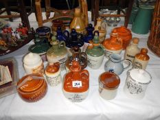 A collection of earthenware jars including whisky & Advertising etc.