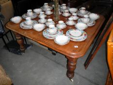 A Victorian mahogany wind out table