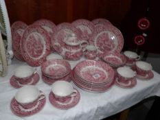 A quantity of pink tea and dinner ware