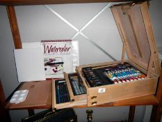 A very good quality 'artists' box, easel, paints, acrylics & pencils etc.