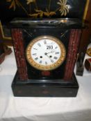 A large Victorian marble clock with pendulum & key