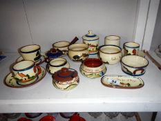 A large quantity of Devon pottery 'mottoware'