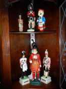 A collection of figurine decanters including soldiers, Irish Mist & Beefeater etc.