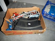 A box of Scalextric cars, track,
