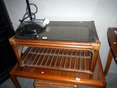 A smoked glass topped coffee table