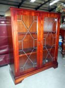 A leaded glass display cabinet