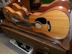 A Tanglewood acoustic guitar and a Palm Beach guitar