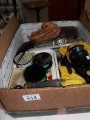 A box of old fishing reels and other fishing items