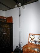 A chrome 3 branch floor standing lamp