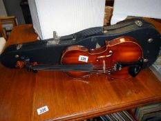 A Boosey & Hawkes Strad violin in case