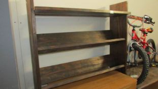 A stained pine bookshelf