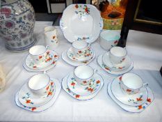 An attractive 6 setting hand painted tea set