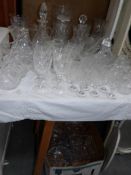 A large quantity of cut glass including vases,