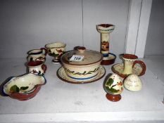 10 items of Devon 'mottoware' including candlesticks, cruets & jugs etc.