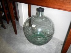 A large glass carboy