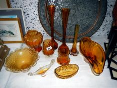 A quantity of amber coloured glass items