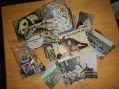 A quantity of cigarette cards & postcards etc.