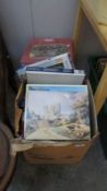 2 boxes of jigsaw puzzles