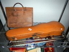 A violin case, 2 violin bows,