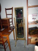 A gilt framed floor standing mirror (frame A/F)