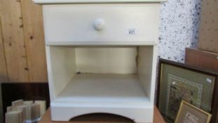 A painted bedside cabinet