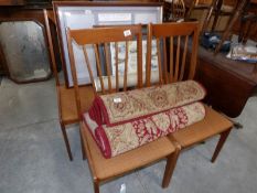 A set of 4 teak dining chairs