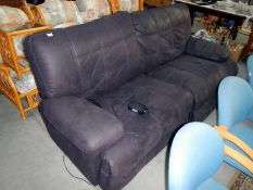 A brushed velvet recliner sofa