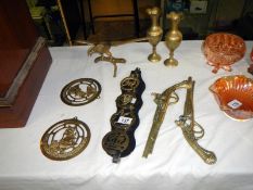 A collection of brassware including horse brasses, eagle figures & vases etc.