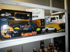 4 model cars including radio controlled & 2 radio controlled helicopters