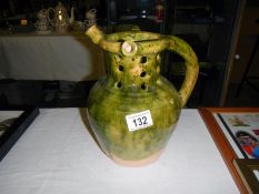 A green pottery vase