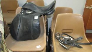 A leather saddle and stirrups