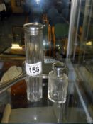 2 Hall marked silver topped cut glass bottles