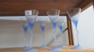 A set of 6 blue stemmed glasses