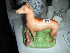 An antique Staffordshire dog with hare