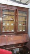 A mahogany double pedestal bureau book case