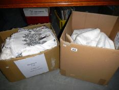 2 boxes of linen including net curtains etc.